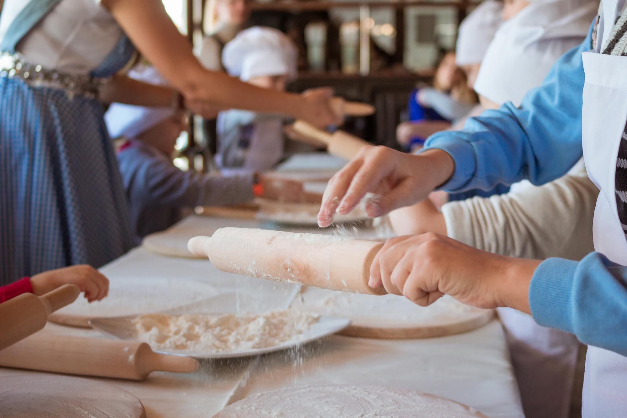 Student kneading dough